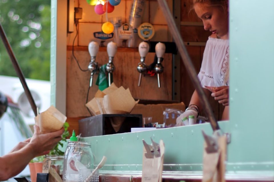 woman selling inside store during daytime