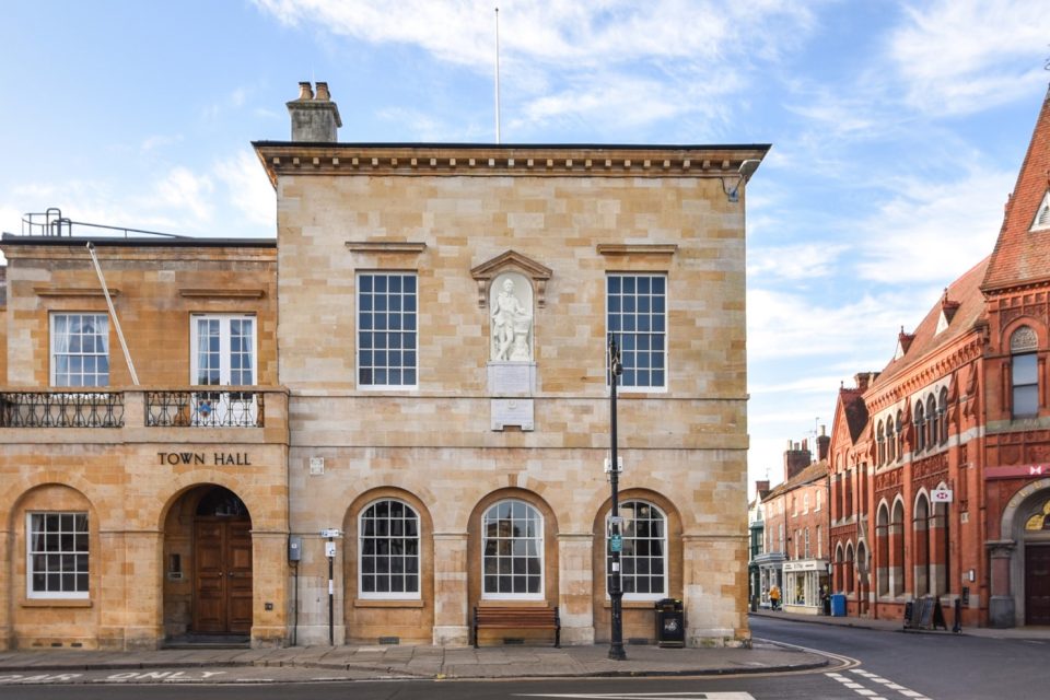 picture shows a stone building on a street